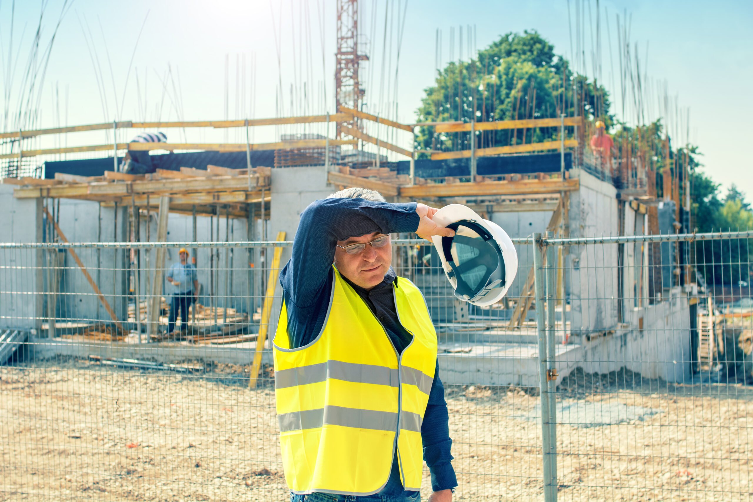 Construction Worker Suffering From Heat Stress