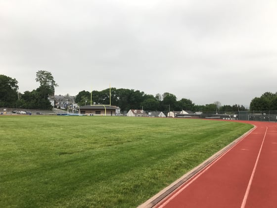 A stormy day at a high school track that could use a weather safety solution for schools